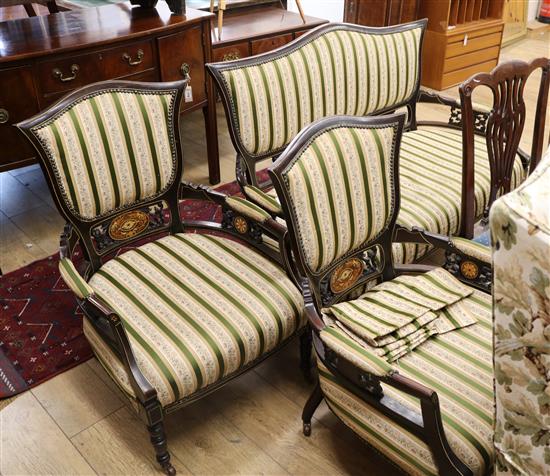A composted Edwardian seven piece inlaid and ebonised salon suite settee W.135cm